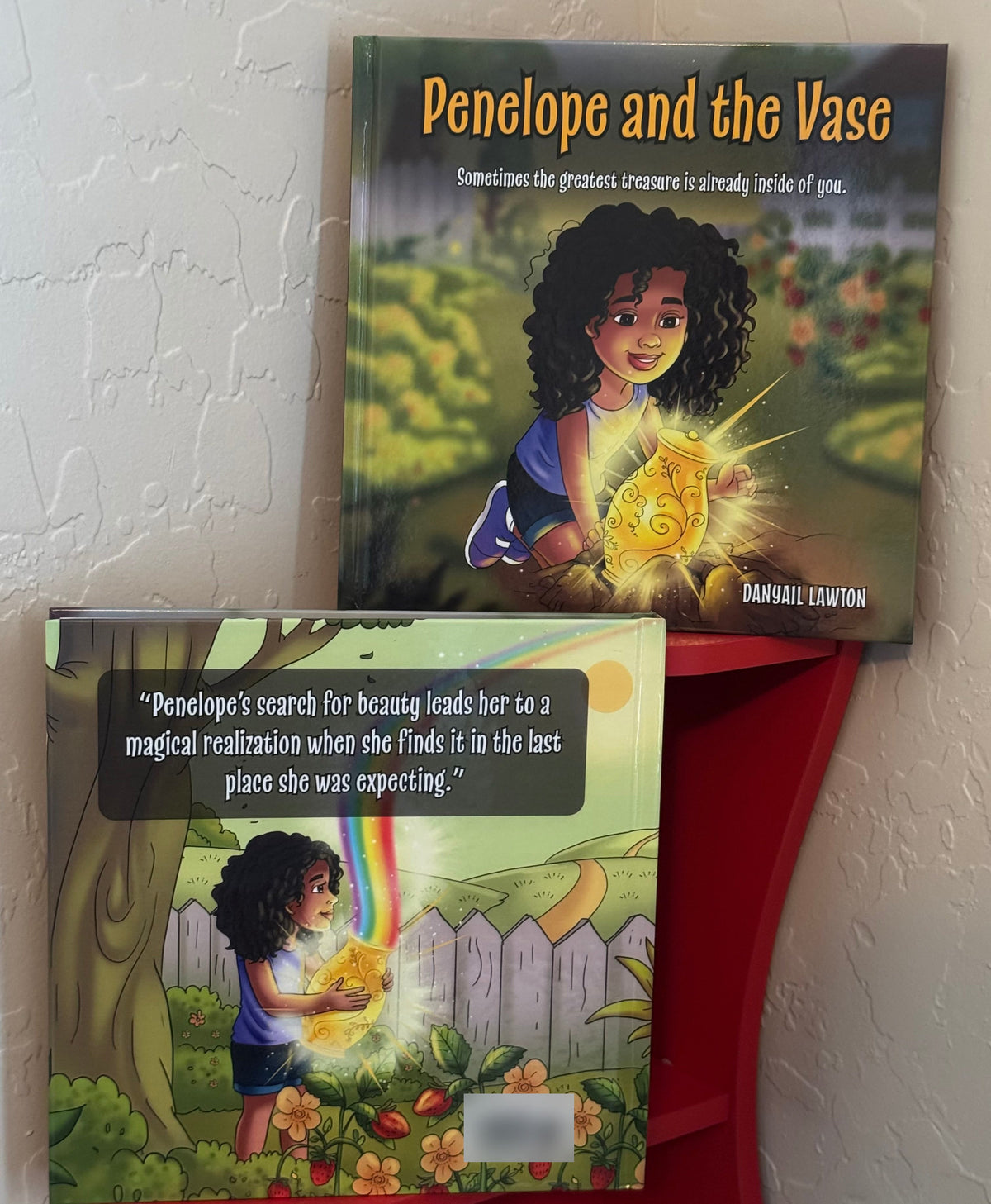 The hardcover of Penelope and the Vase, front cover and back cover. The back reads: Penelope's search for beauty leads her to a magical realization when she finds it in the last place she was expecting.